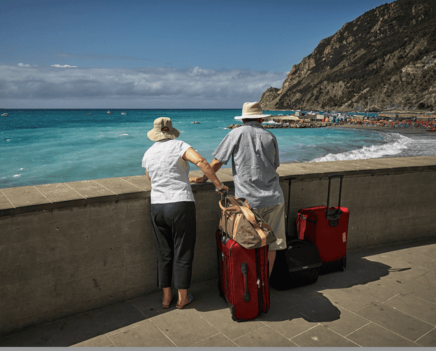 two seniors with luggage